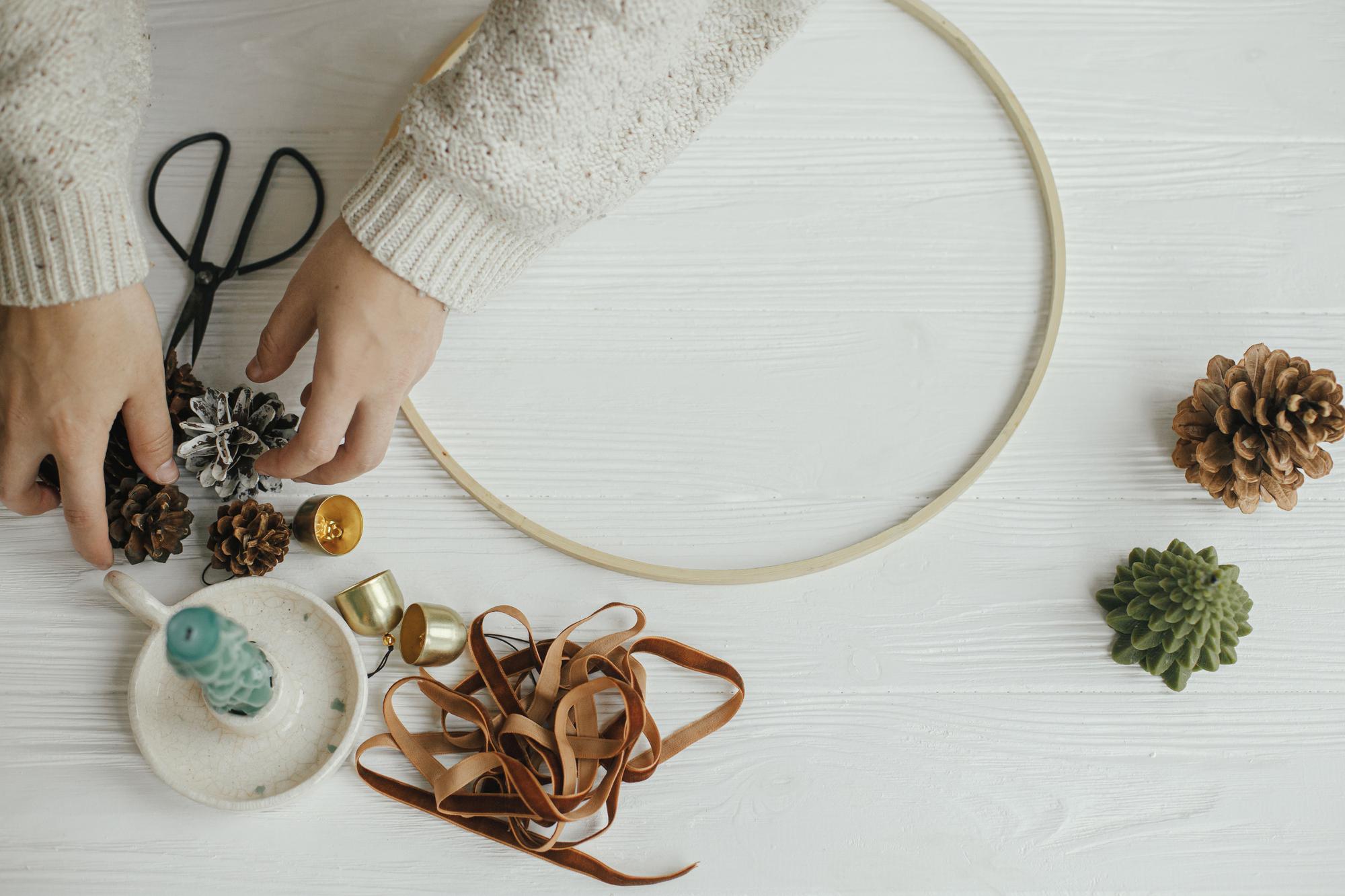 Studio hands arranging threads and hoops